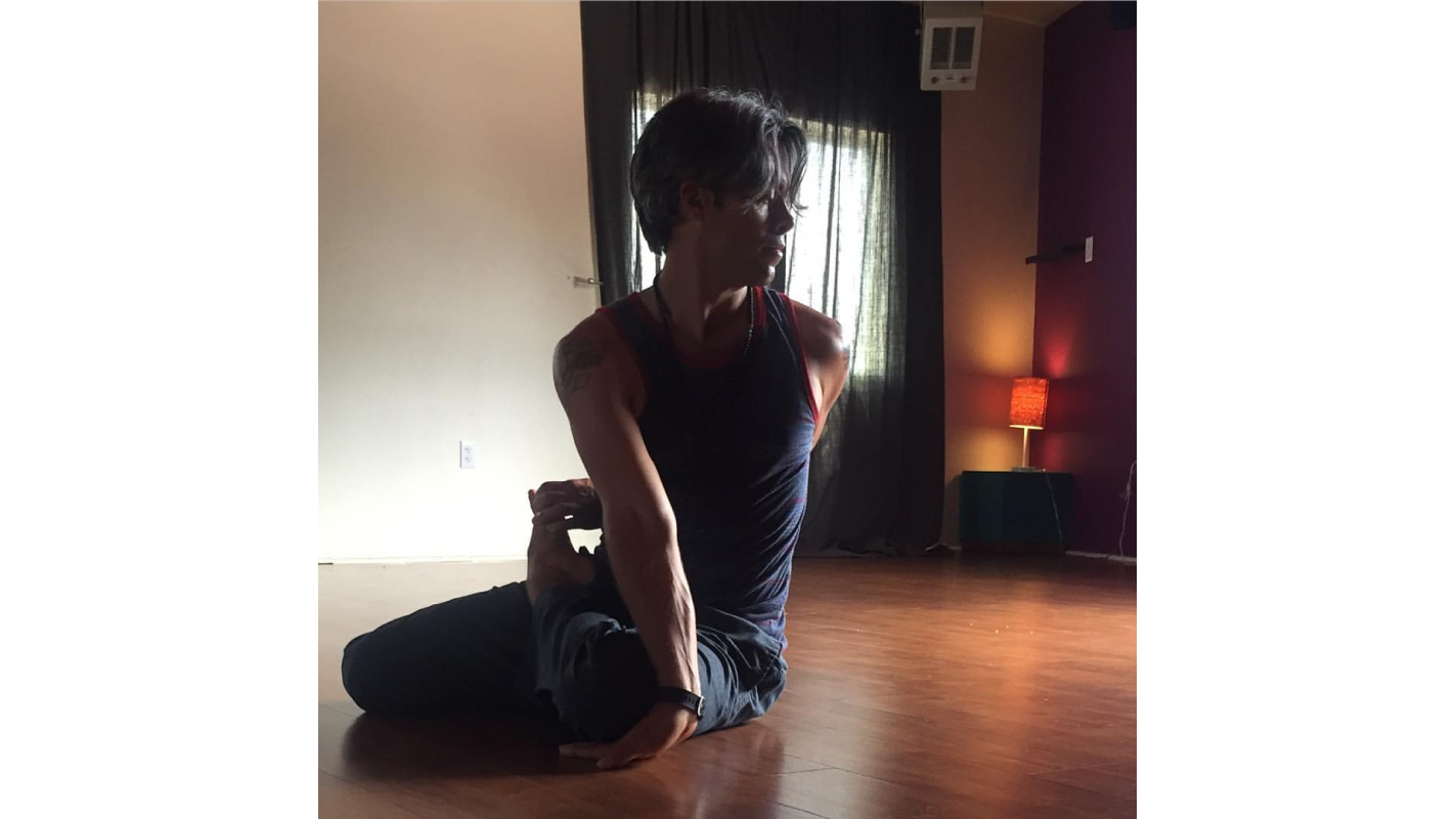 Photo of Austin in yoga pose